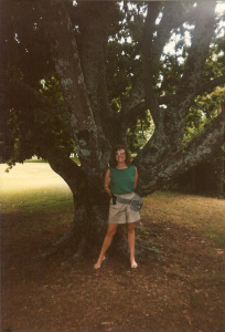 Cathy standing by a huge tree in Australia.